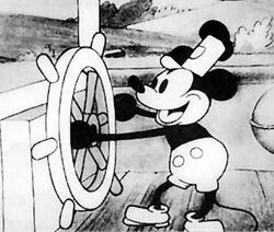 Micky in Steamboat Willie, dem Film, mit dem er große Bekanntheit erlangte (sein Debut hatte Micky schon früher in Plane Crazy und The Gallopin' Gaucho, die allerdings nur einem begrenzten Publikum zugänglich gemacht wurden.) (© Disney)